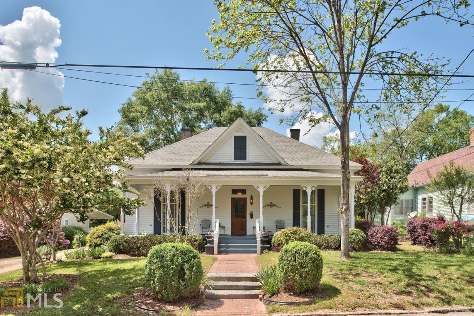 291 Pine Street Madison, GA 30650 - Photo 1 of 1 a front view of a house with garden