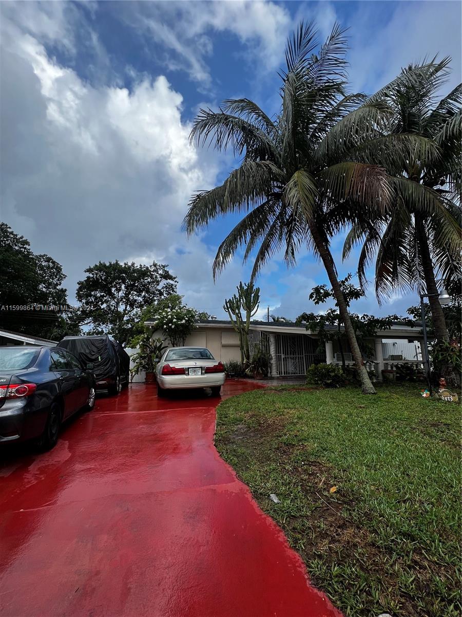 629 Southwest 4th Street Hallandale Beach, FL 33009 - Photo 1 of 4 a view of a backyard with swimming pool
