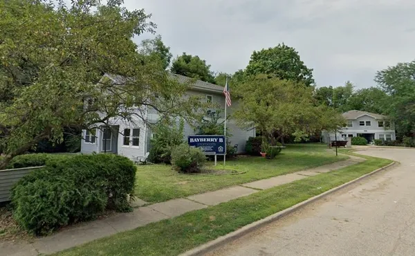 a view of a house with a back yard