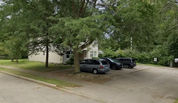 a car parked in front of a house