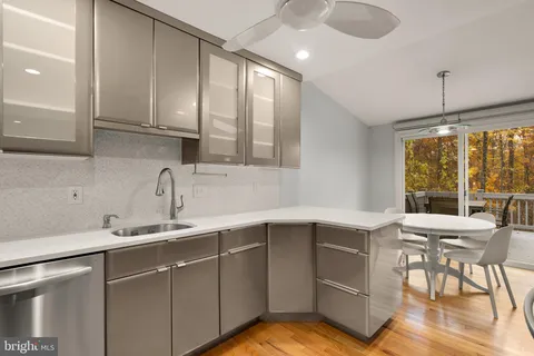 a kitchen with a sink cabinets and window