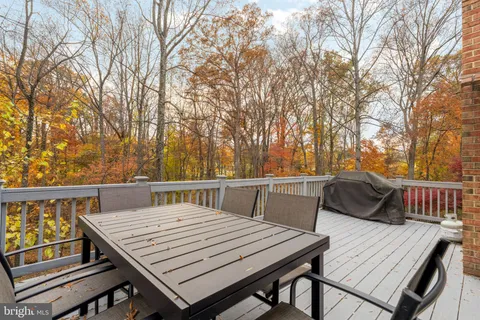 a view of a table and chairs on the roof deck