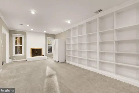 a room with granite countertop cabinets and sink