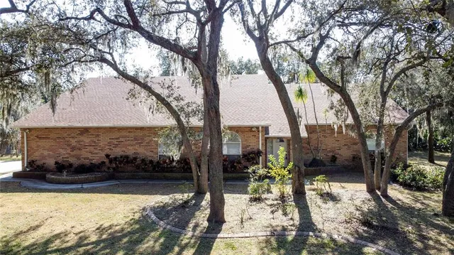 a view of a backyard with sitting area