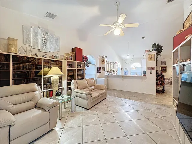 a large kitchen with a table and chairs