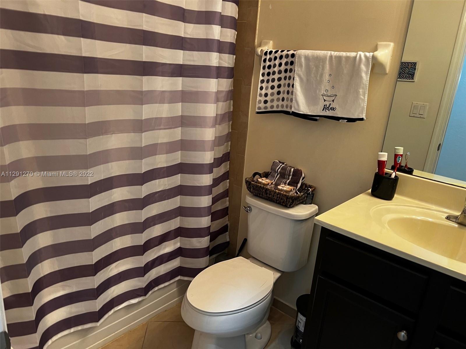 Oasis Homestead, FL 33033 - Photo 12 of 24 a bathroom with a sink and a toilet
