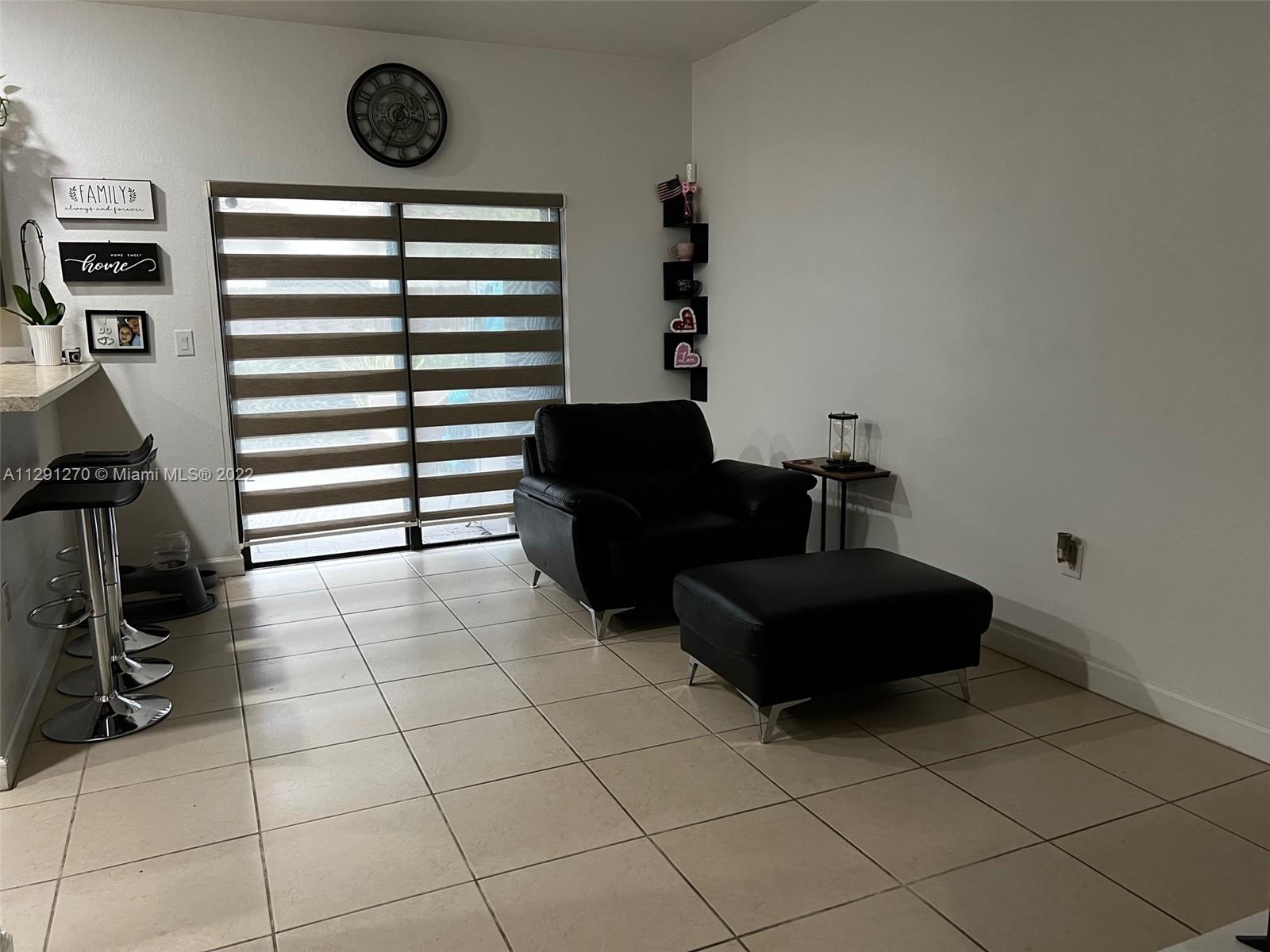 Oasis Homestead, FL 33033 - Photo 14 of 24 a view of a livingroom with furniture and a window