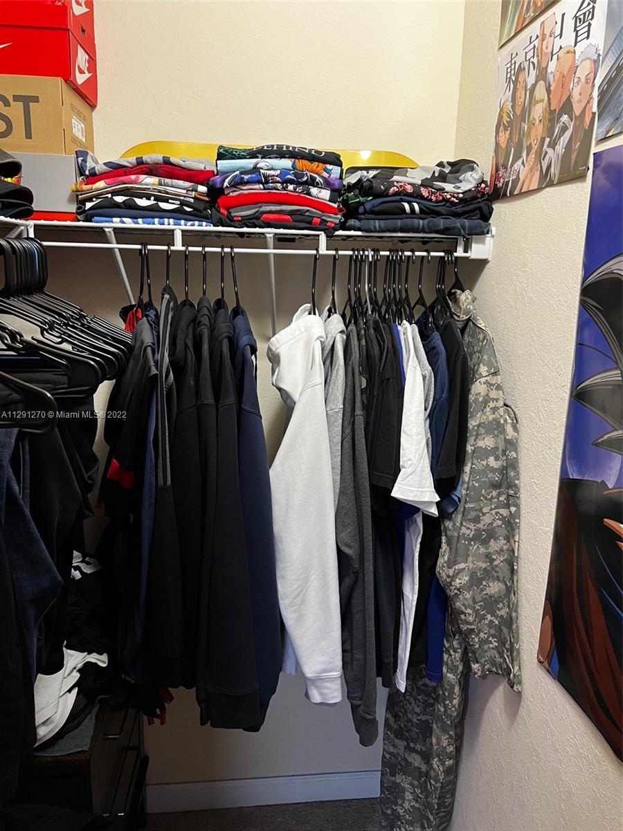 Oasis Homestead, FL 33033 - Photo 23 of 24 a close up view of a walk in closet