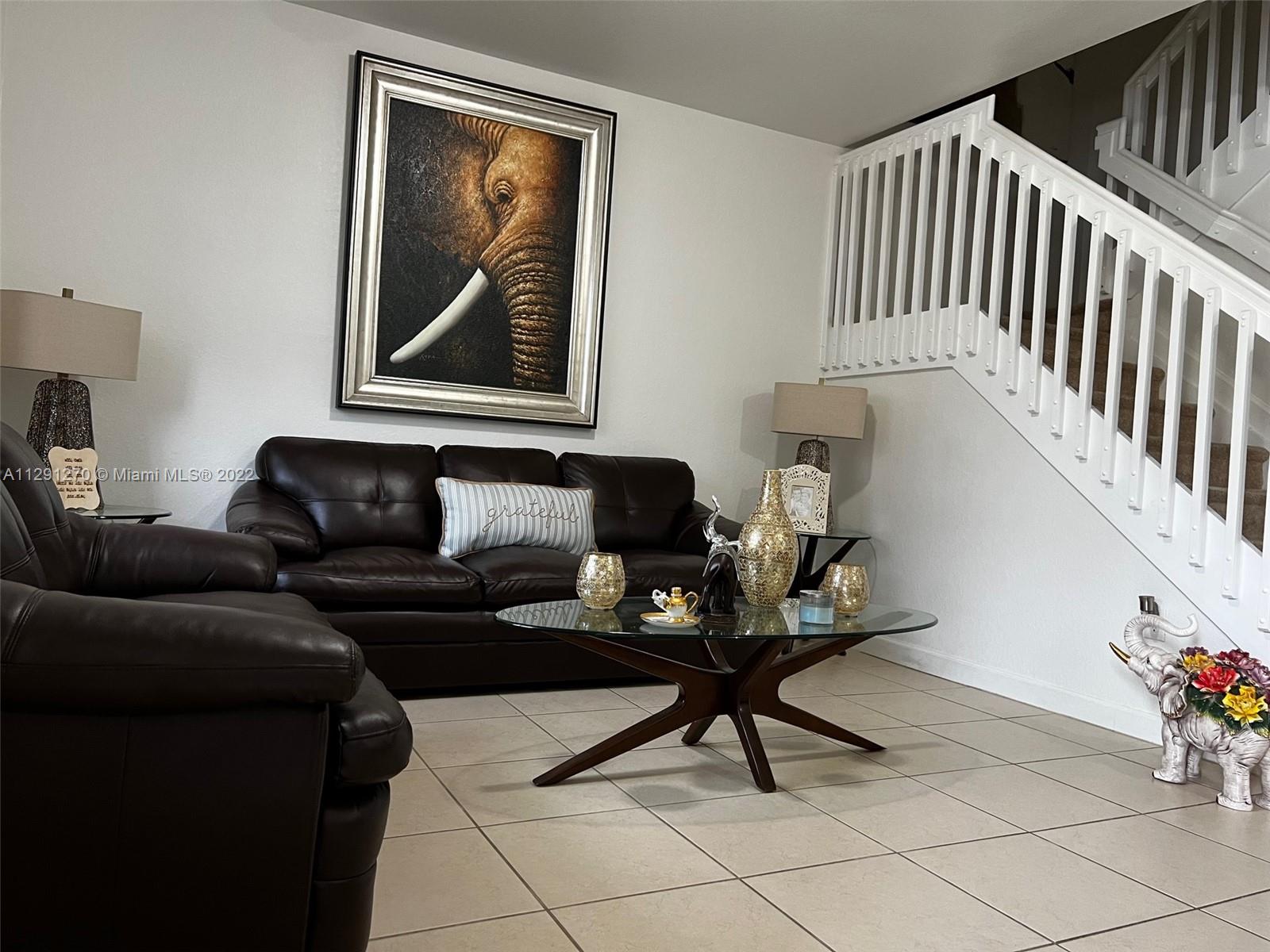 Oasis Homestead, FL 33033 - Photo 4 of 24 a living room with furniture and wooden floor
