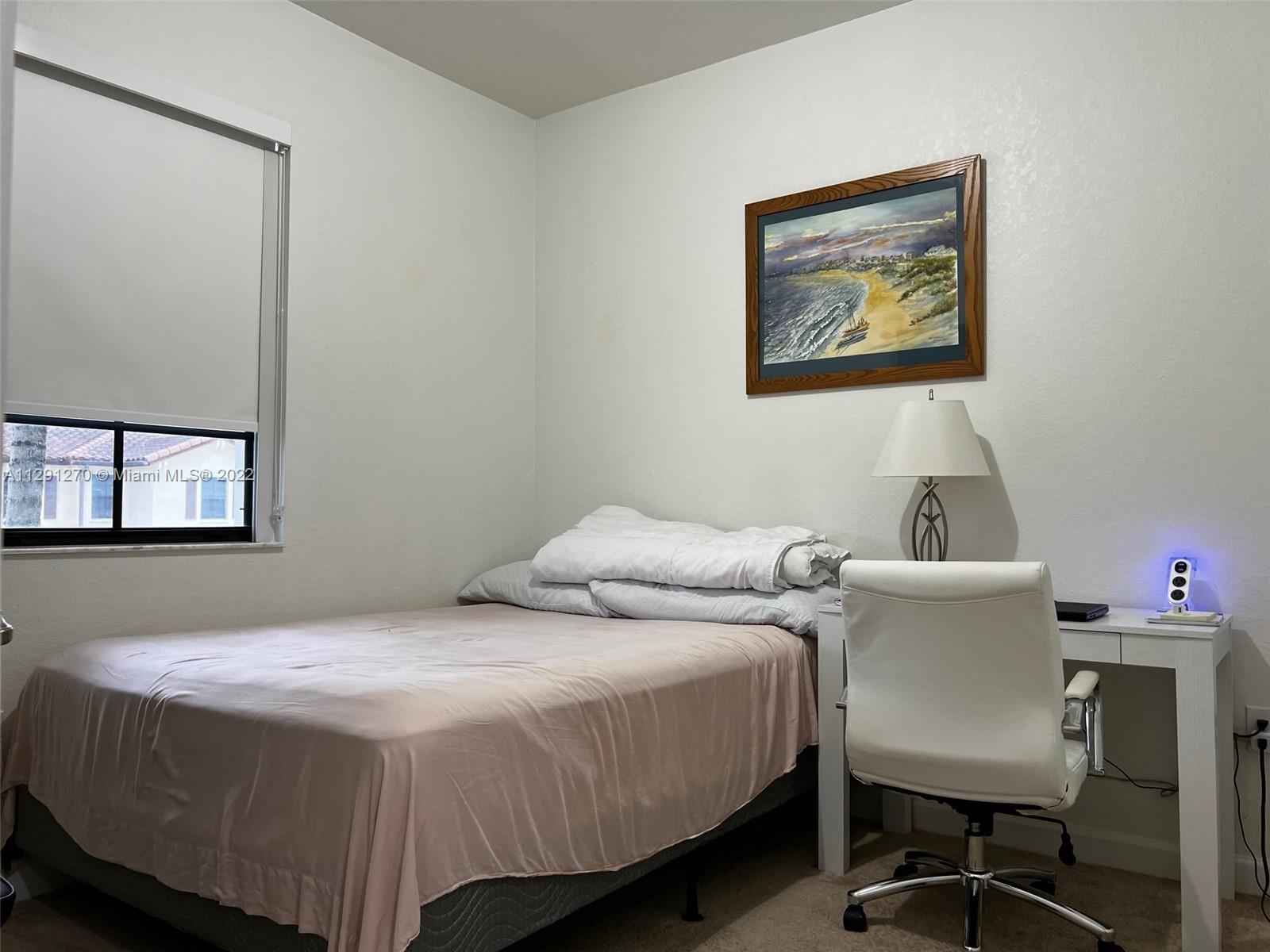 Oasis Homestead, FL 33033 - Photo 6 of 24 a bedroom with a bed and a desk