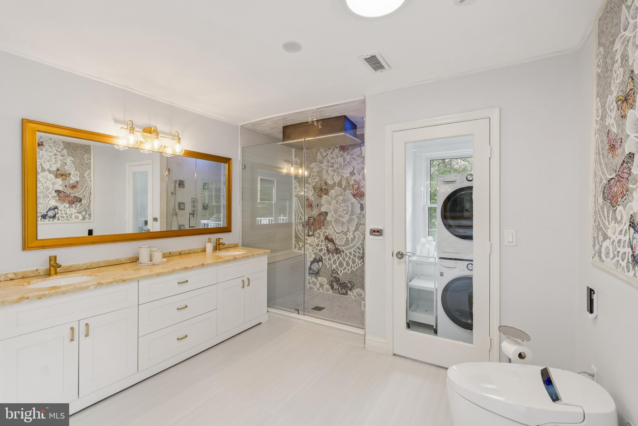 10900 Tara Road Potomac, MD 20854 - Photo 19 of 33 a bathroom with a granite countertop sink mirror and shower