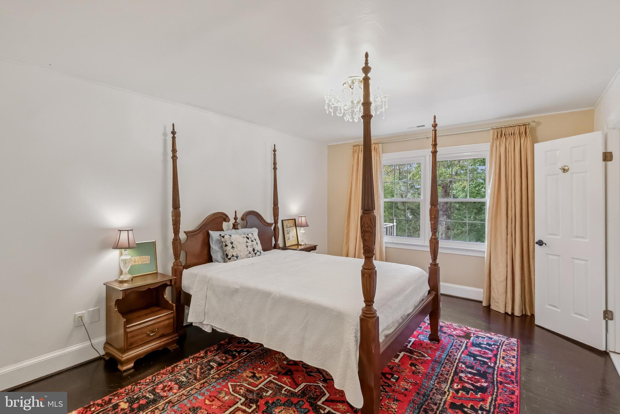 10900 Tara Road Potomac, MD 20854 - Photo 23 of 33 a bedroom with a bed and a dresser next to a window