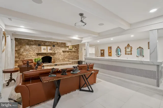 a large white kitchen with stainless steel appliances kitchen island granite countertop a sink and cabinets
