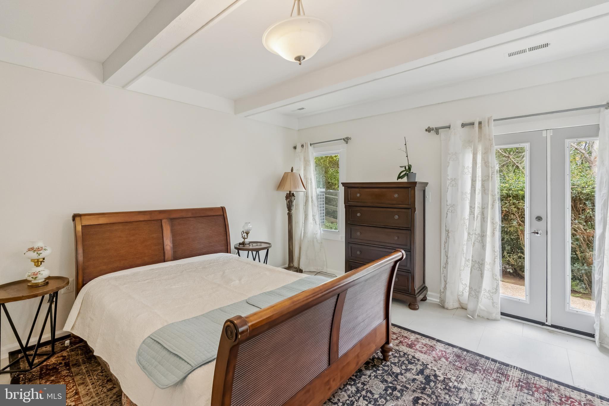 10900 Tara Road Potomac, MD 20854 - Photo 31 of 33 a bedroom with a bed and wooden floor