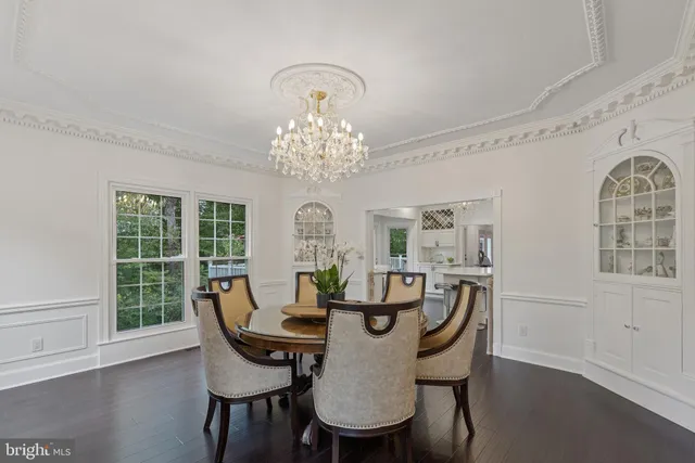 a large kitchen with a table and chairs