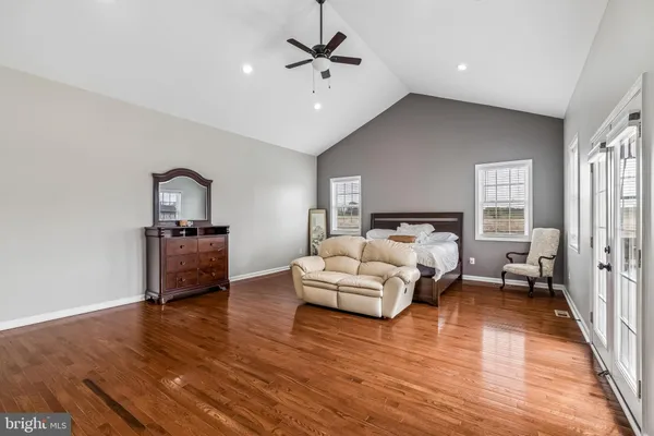 a living room with furniture window and wooden floor