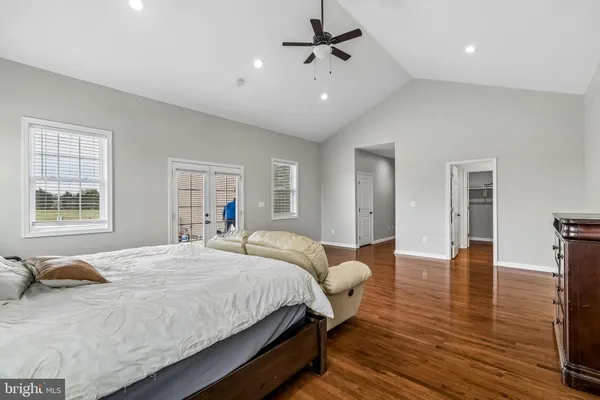 a bedroom with bed and window