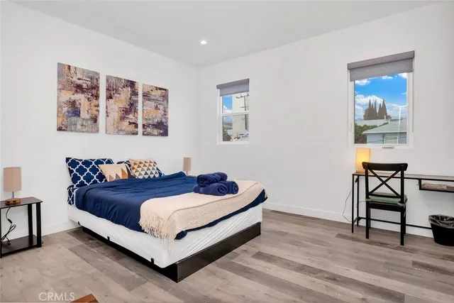 a bed sitting in a bedroom and a table