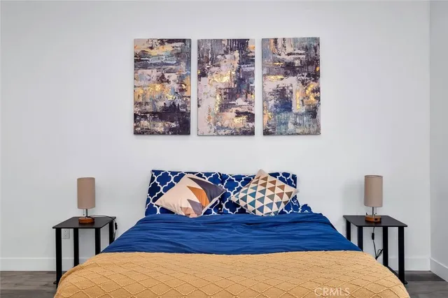 a bedroom with a bed and cupboard