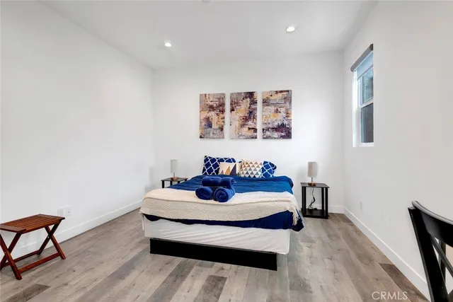 a bedroom with a bed and a desk