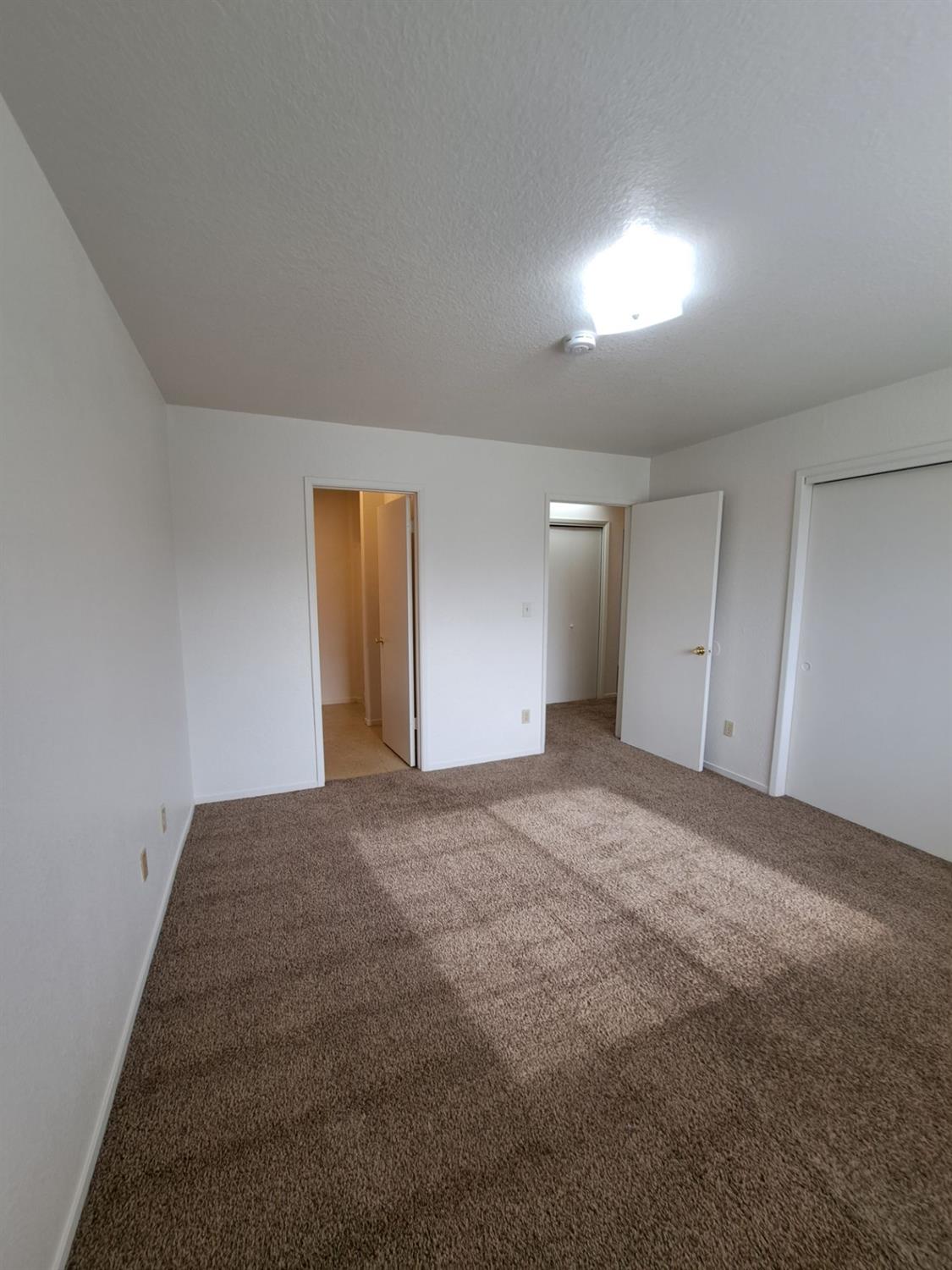 12486 Georgia Lane Madera, CA 93637 - Photo 11 of 17 a view of an empty room and window