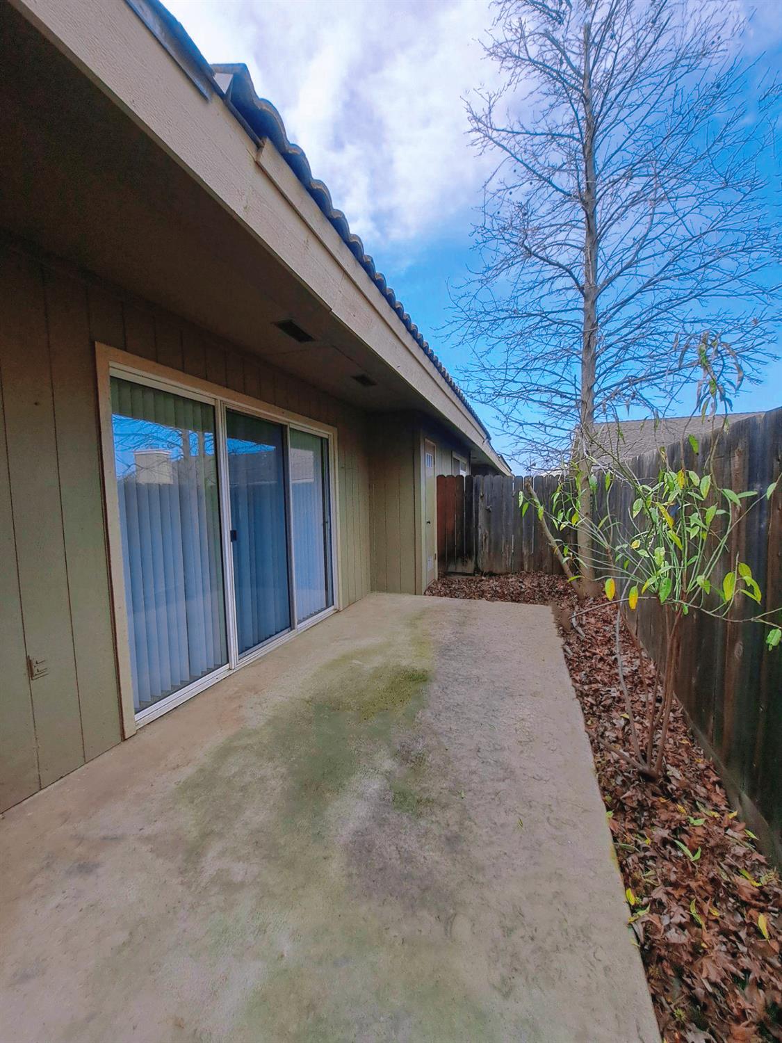 12486 Georgia Lane Madera, CA 93637 - Photo 16 of 17 a view of a house with a yard