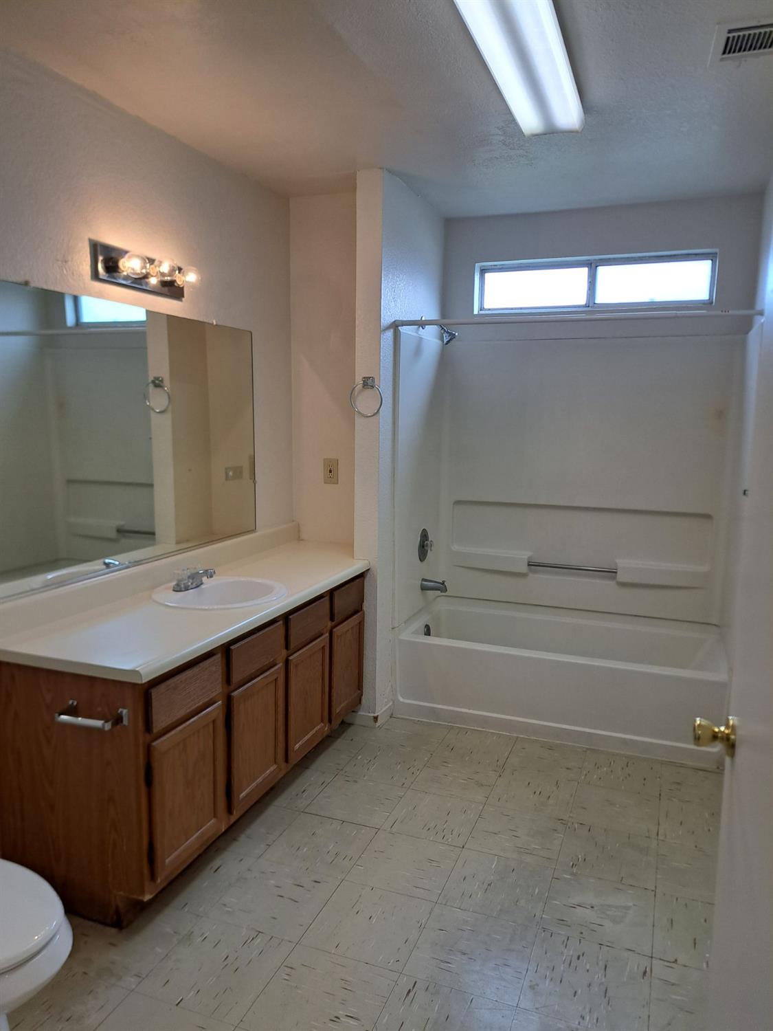 12486 Georgia Lane Madera, CA 93637 - Photo 8 of 17 a bathroom with a sink and a mirror