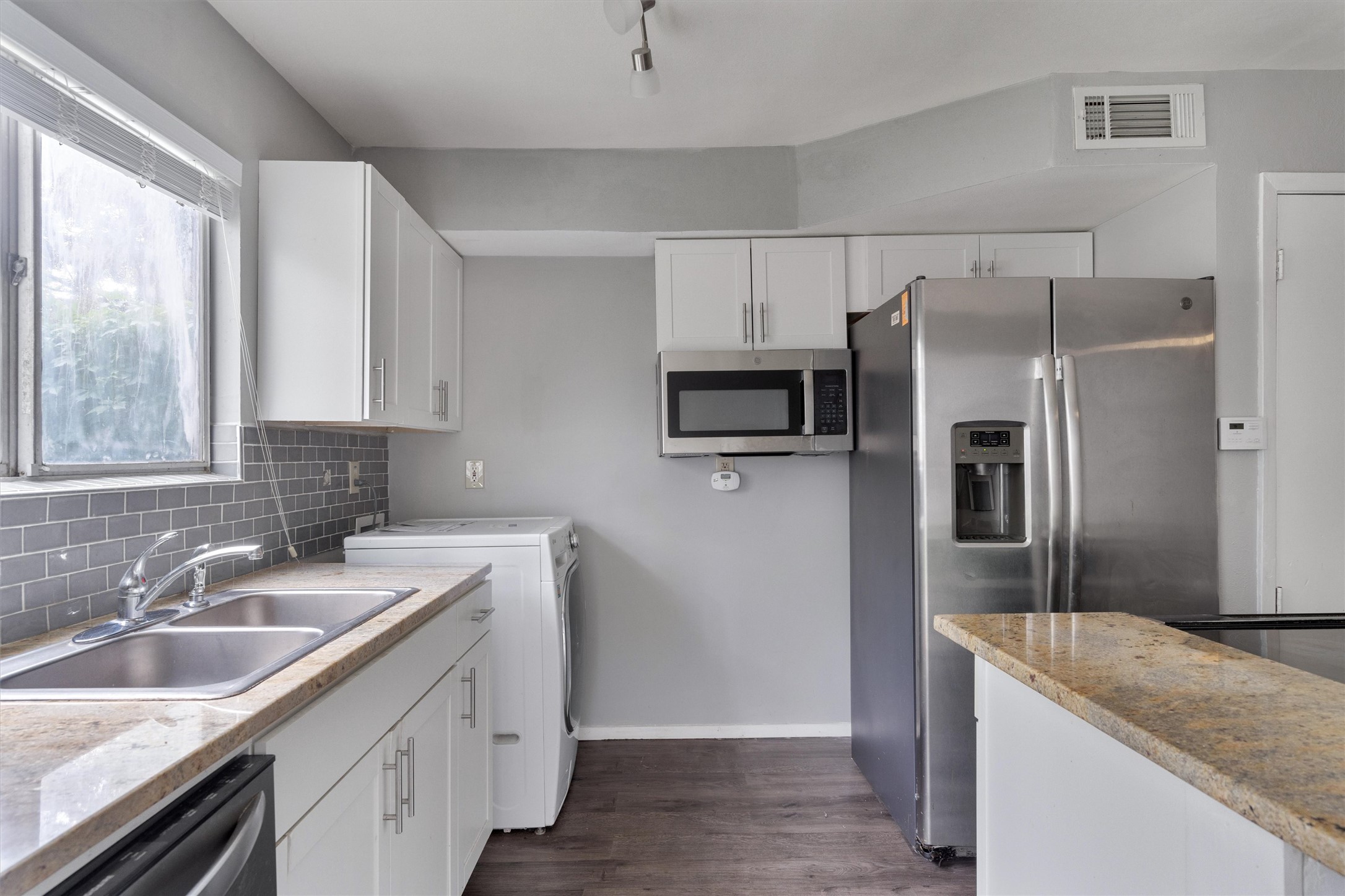 3415 Menchaca Road, Unit 113 Austin, TX 78704 - Photo 6 of 21 a kitchen with a sink stove and refrigerator