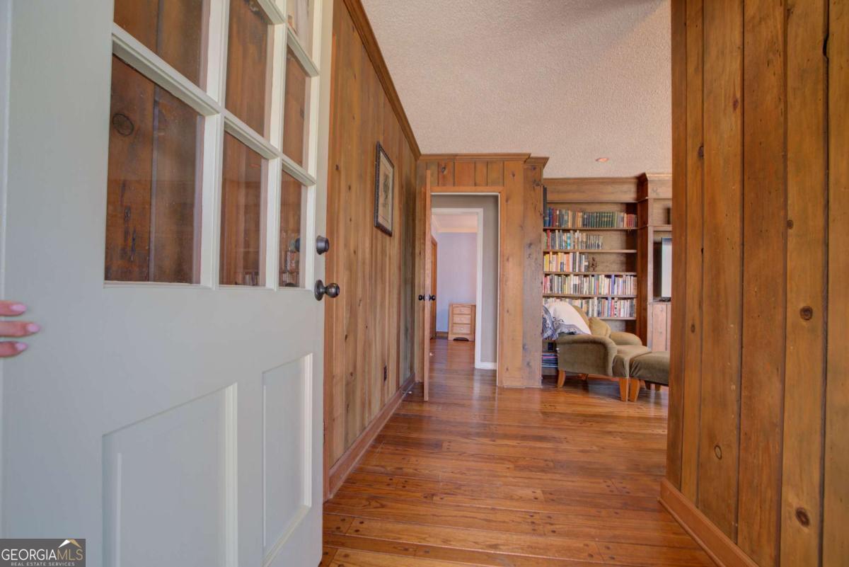 1043 Wilkerson Road Southwest Rome, GA 30165 - Photo 15 of 52 a view of a hallway with wooden floor and furniture