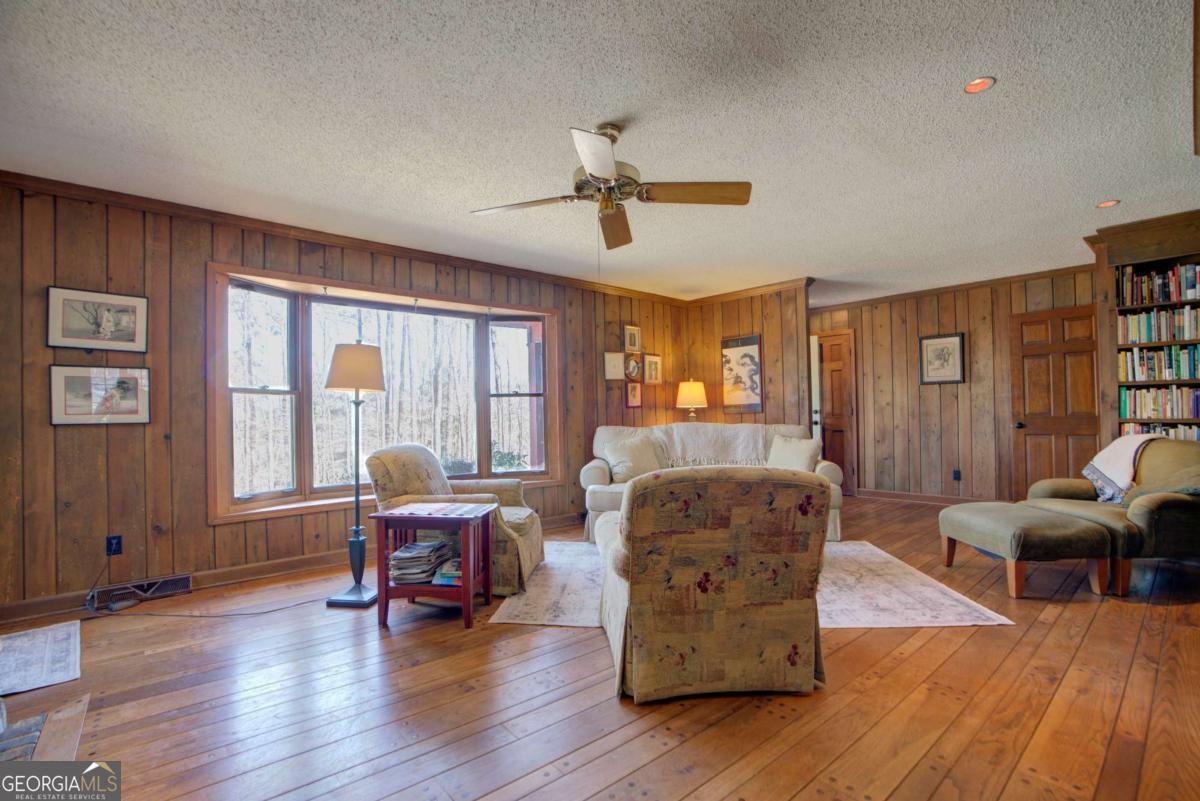 1043 Wilkerson Road Southwest Rome, GA 30165 - Photo 19 of 52 a living room with furniture and wooden floor