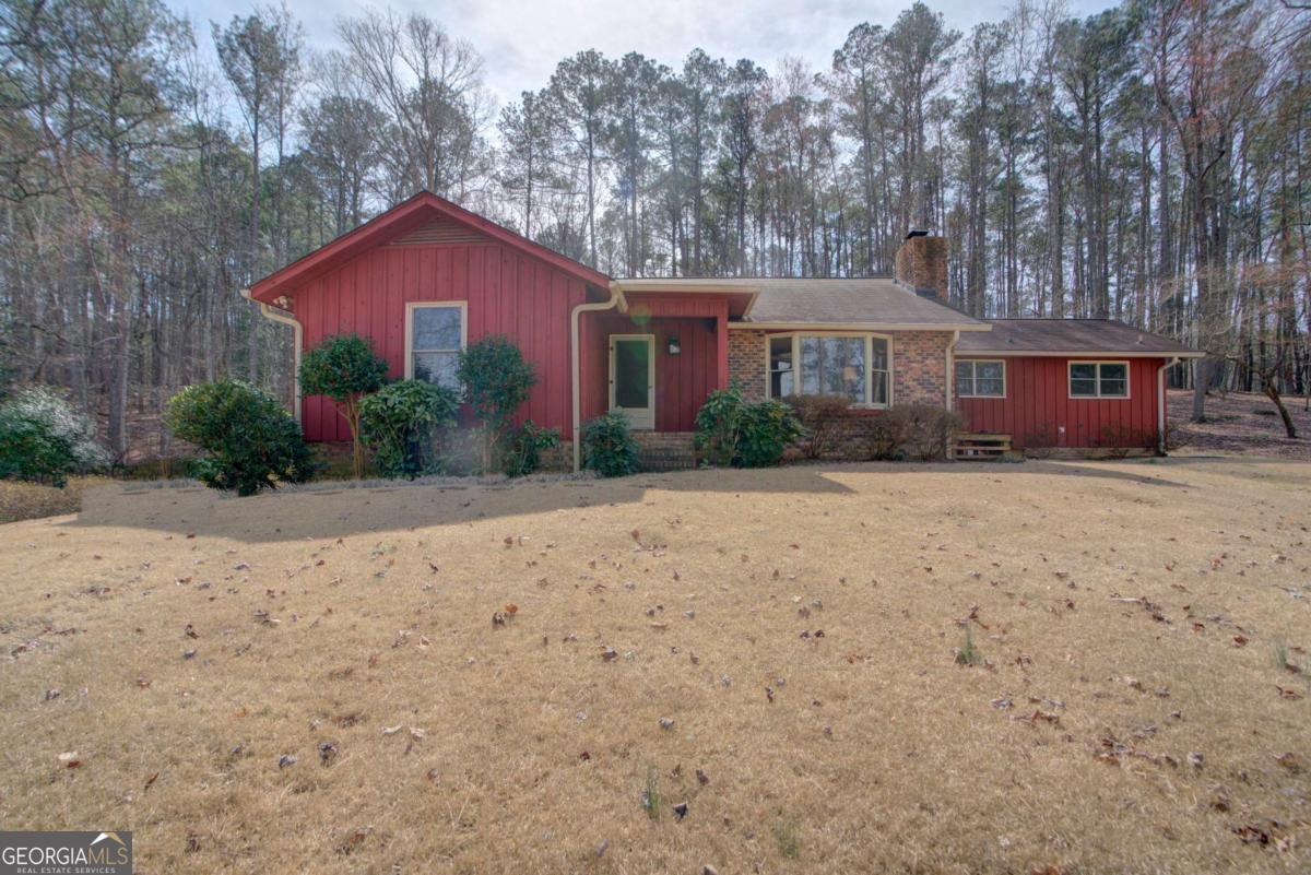 1043 Wilkerson Road Southwest Rome, GA 30165 - Photo 48 of 52 a view of a house with a yard