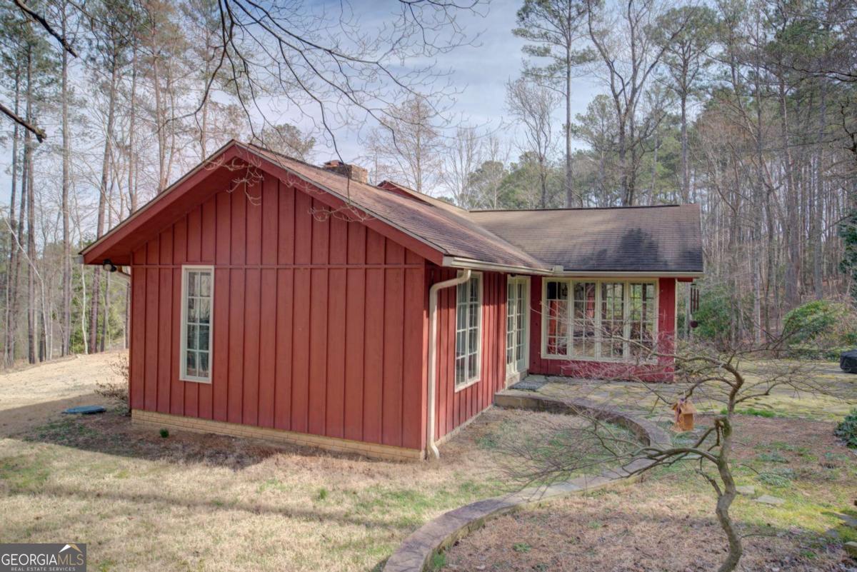1043 Wilkerson Road Southwest Rome, GA 30165 - Photo 49 of 52 a front view of a house with a yard