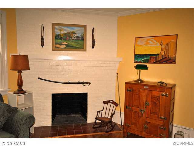 4237 Arrowhead Road Richmond, VA 23235 - Photo 4 of 14 a living room with furniture and a fireplace