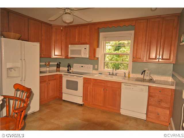 4237 Arrowhead Road Richmond, VA 23235 - Photo 7 of 14 a kitchen with stainless steel appliances granite countertop a stove a sink dishwasher and a refrigerator