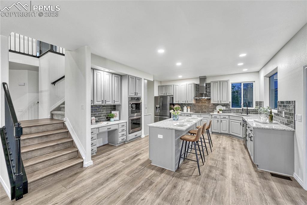 1185 Bowstring Road Monument, CO 80132 - Photo 11 of 46 a kitchen with a sink appliances and cabinets