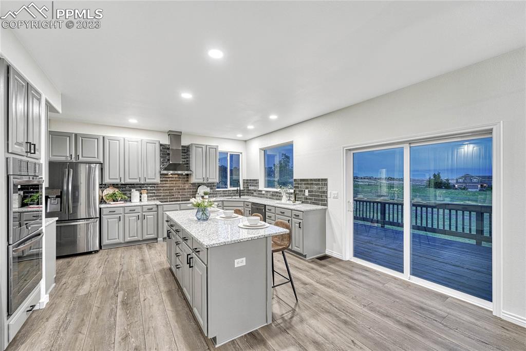 1185 Bowstring Road Monument, CO 80132 - Photo 12 of 46 a kitchen with a sink stainless steel appliances and counter space