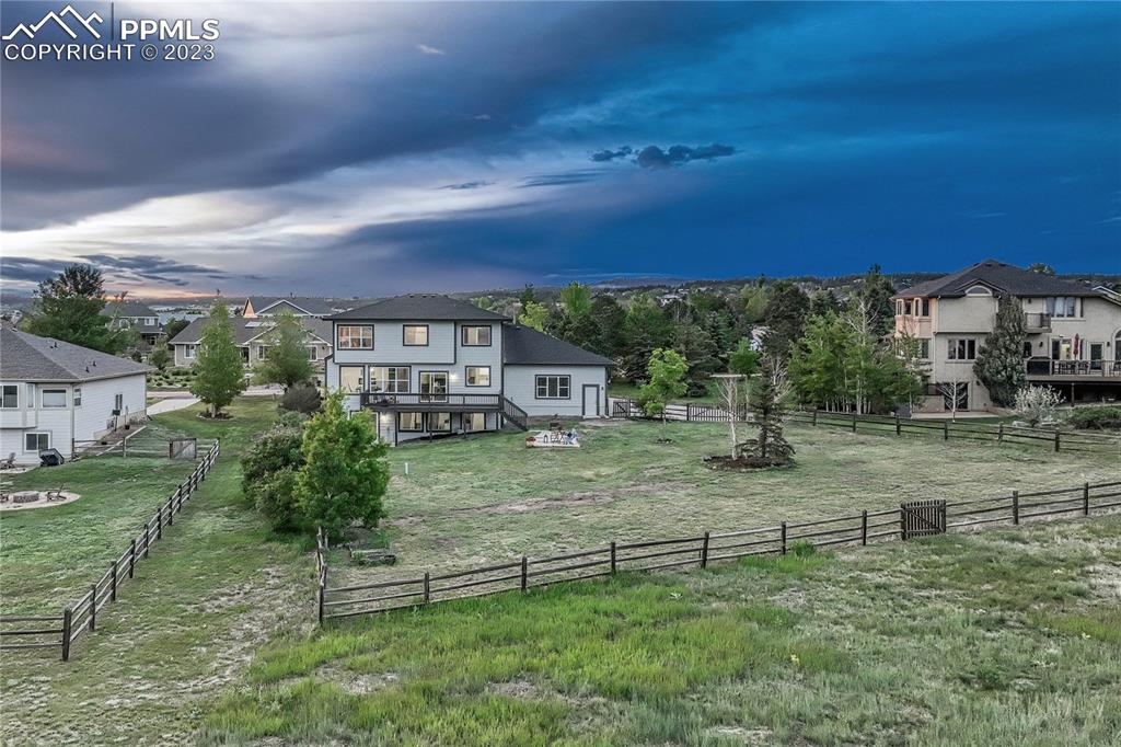 1185 Bowstring Road Monument, CO 80132 - Photo 2 of 46 an aerial view of a house with garden space and street view