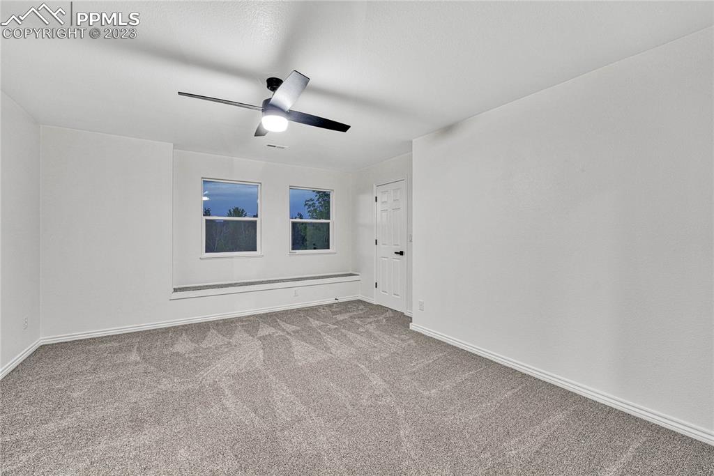 1185 Bowstring Road Monument, CO 80132 - Photo 28 of 46 a view of empty room with ceiling fan