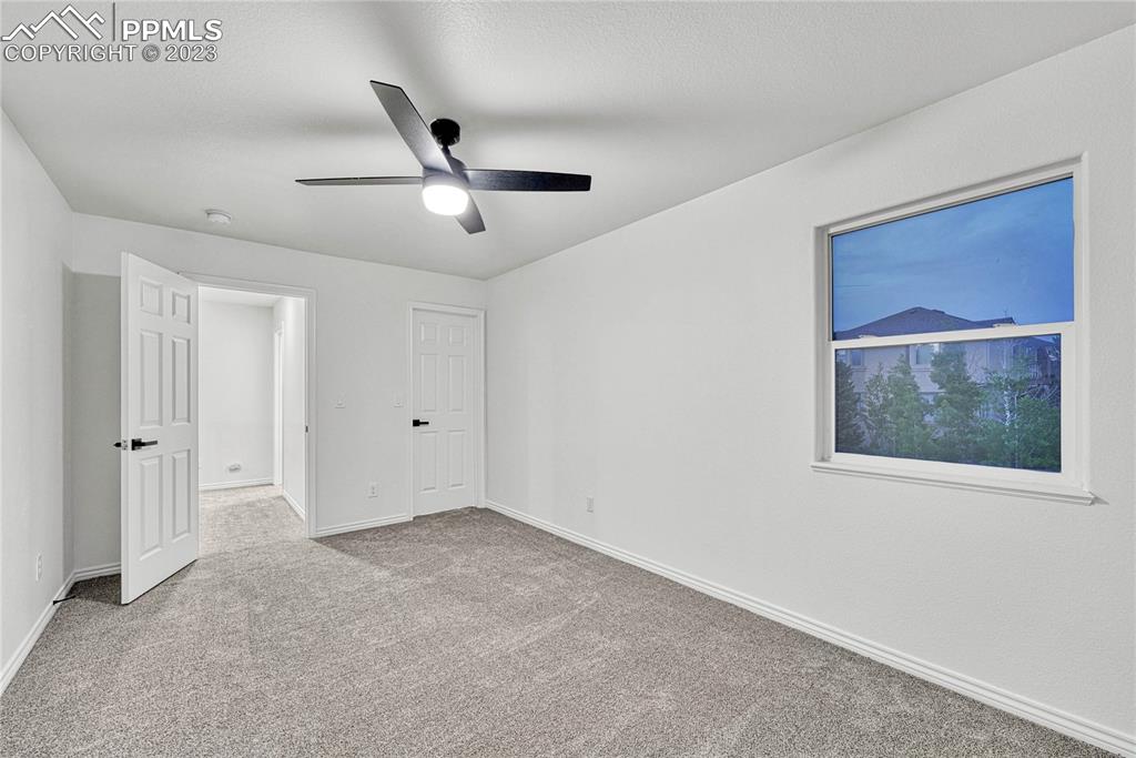 1185 Bowstring Road Monument, CO 80132 - Photo 30 of 46 a view of an empty room with a window