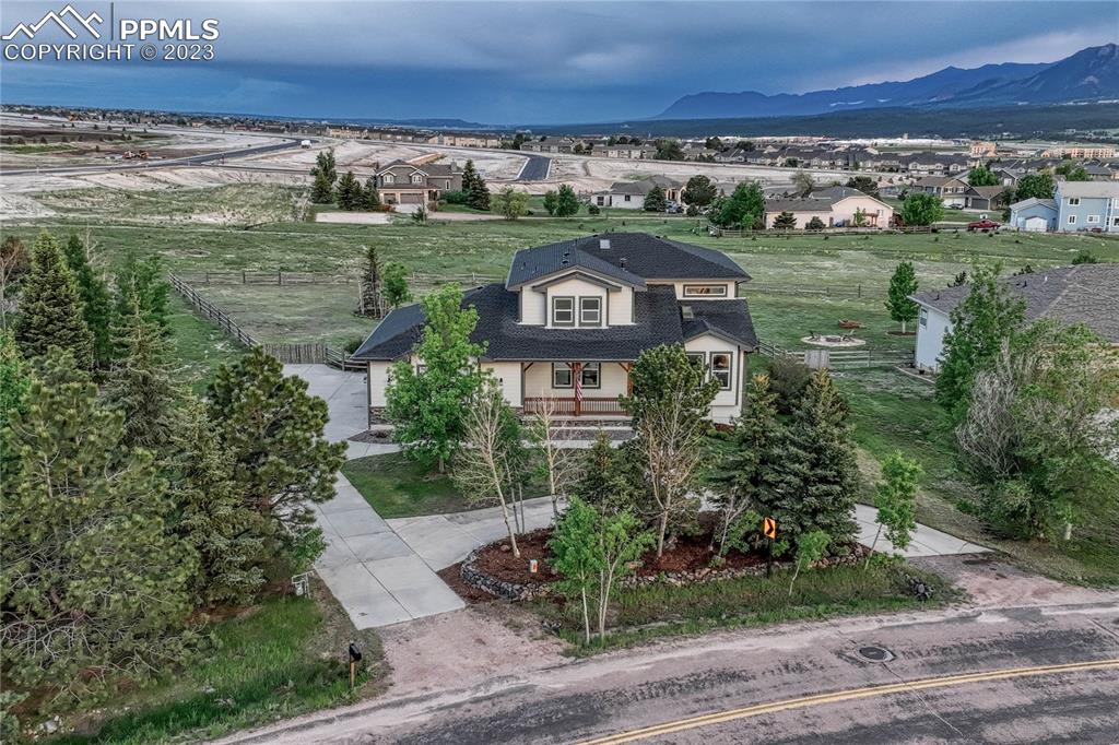 1185 Bowstring Road Monument, CO 80132 - Photo 40 of 46 an aerial view of a house with a garden and lake view