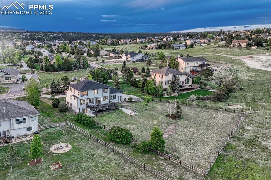 1185 Bowstring Road Monument, CO 80132 - Photo 44 of 46 an aerial view of a house with a yard