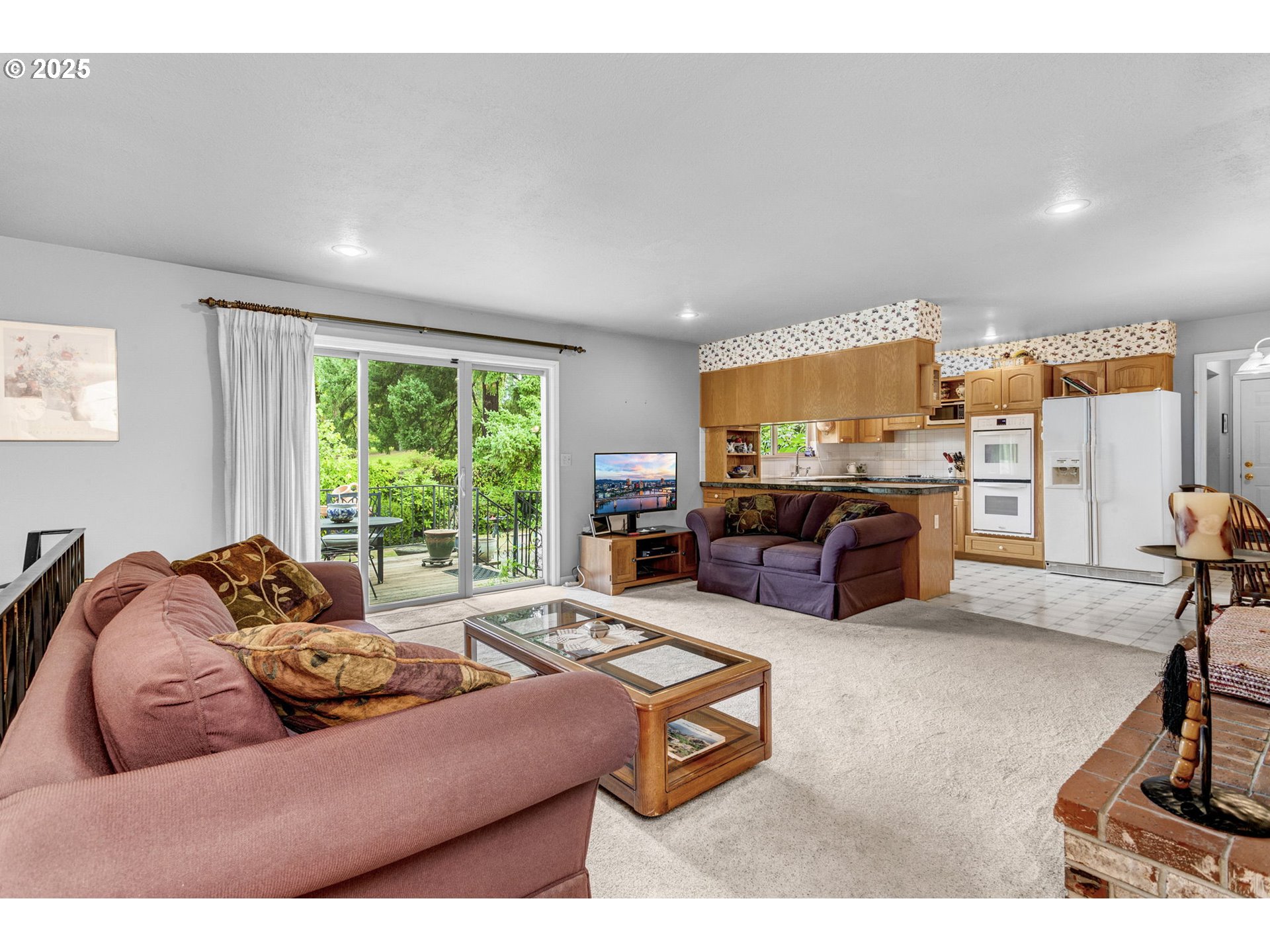 1114 Northeast 137th Avenue Portland, OR 97230 - Photo 18 of 45 a living room with furniture and a flat screen tv