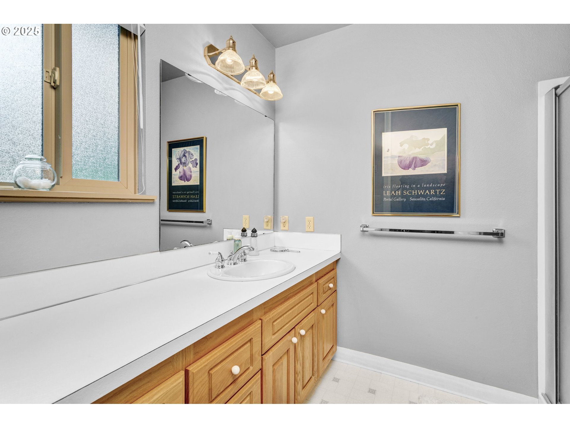 1114 Northeast 137th Avenue Portland, OR 97230 - Photo 23 of 45 a bathroom with a sink a mirror and a window