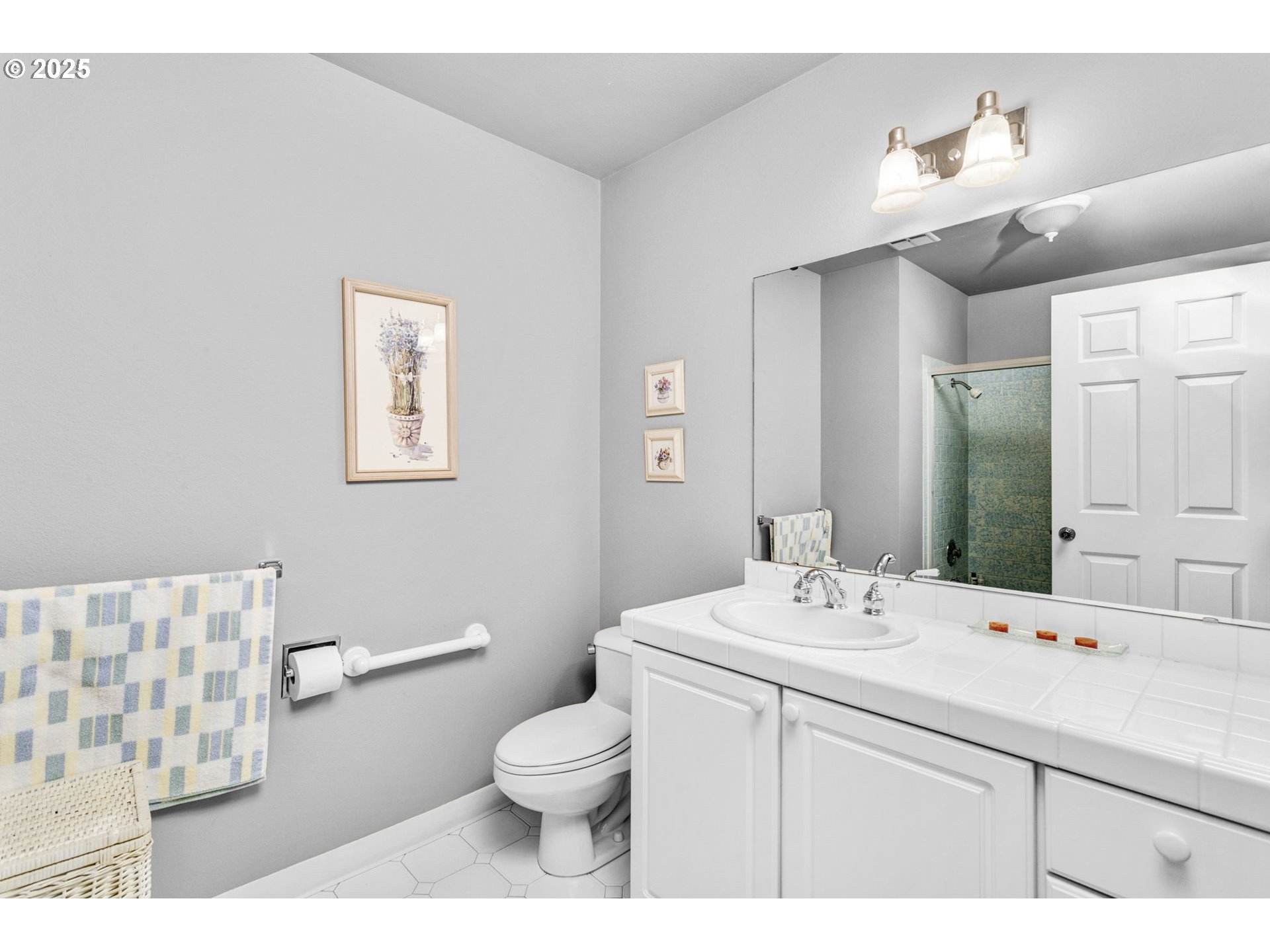 1114 Northeast 137th Avenue Portland, OR 97230 - Photo 24 of 45 a bathroom with a sink toilet and mirror