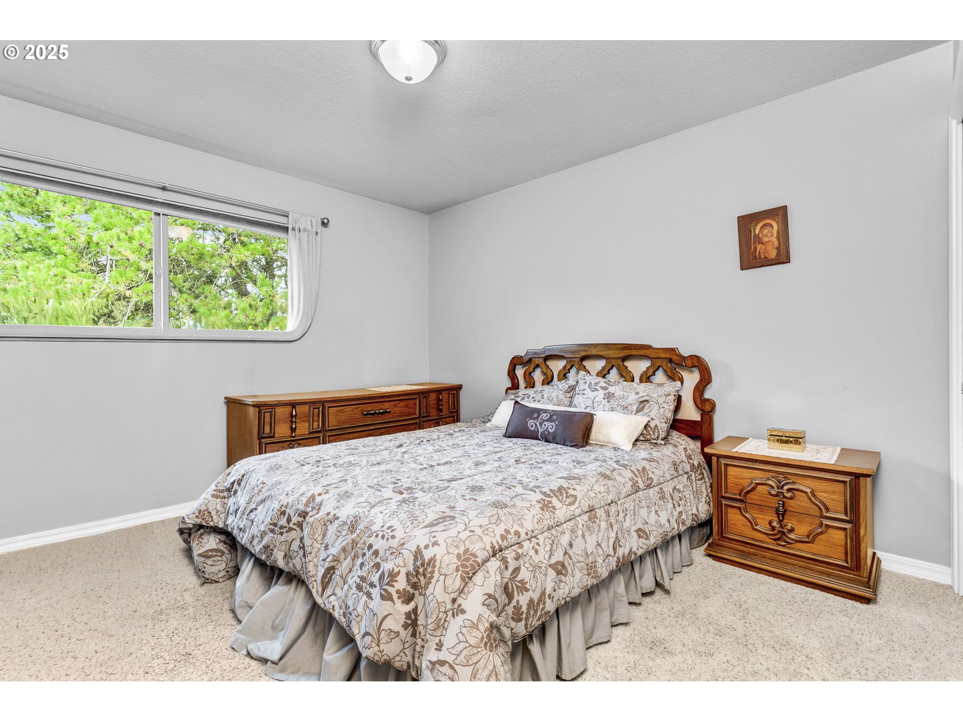 1114 Northeast 137th Avenue Portland, OR 97230 - Photo 27 of 45 a bedroom with a bed and a window