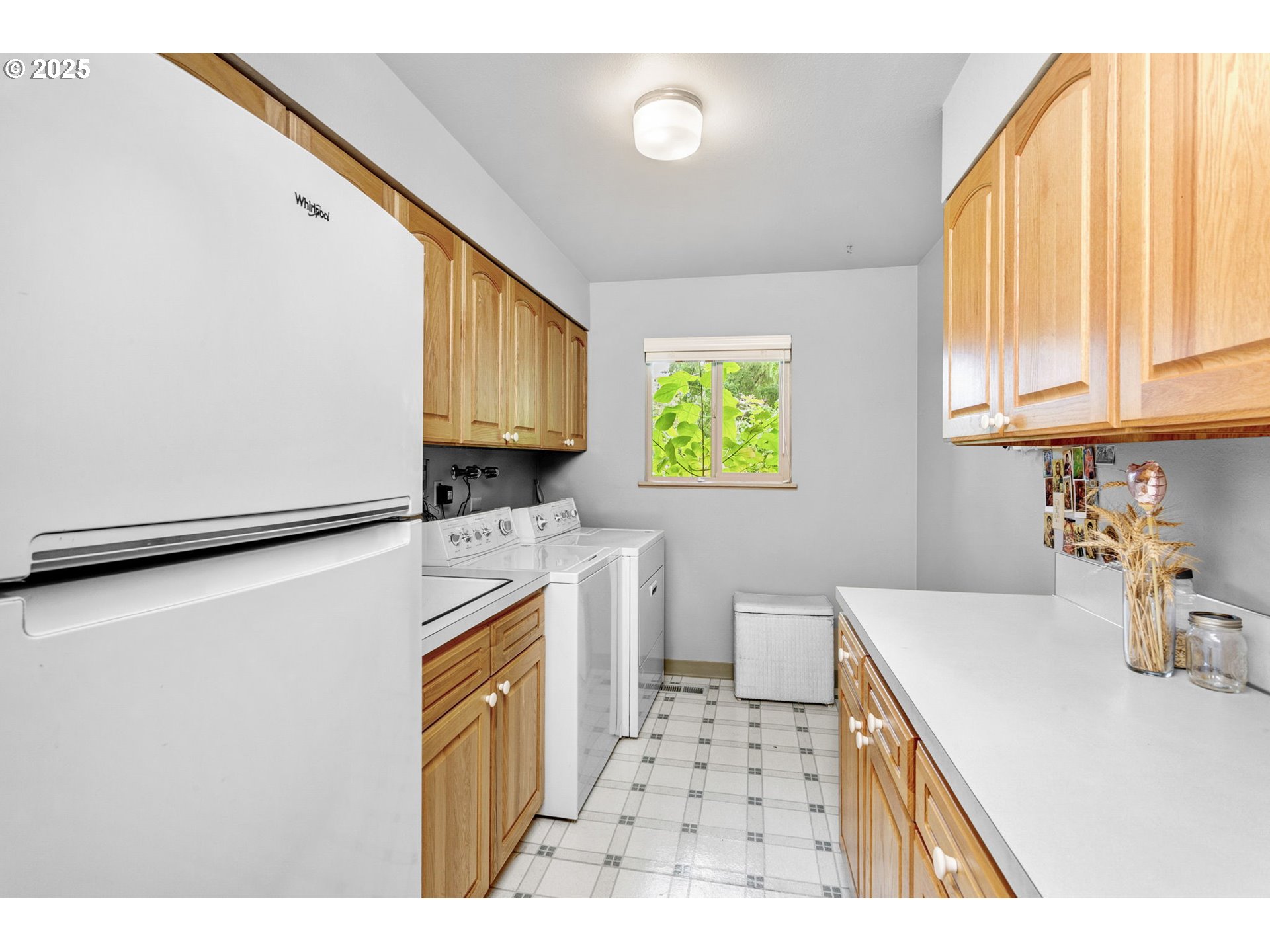 1114 Northeast 137th Avenue Portland, OR 97230 - Photo 28 of 45 a kitchen with a refrigerator a stove a sink dishwasher and wooden cabinets