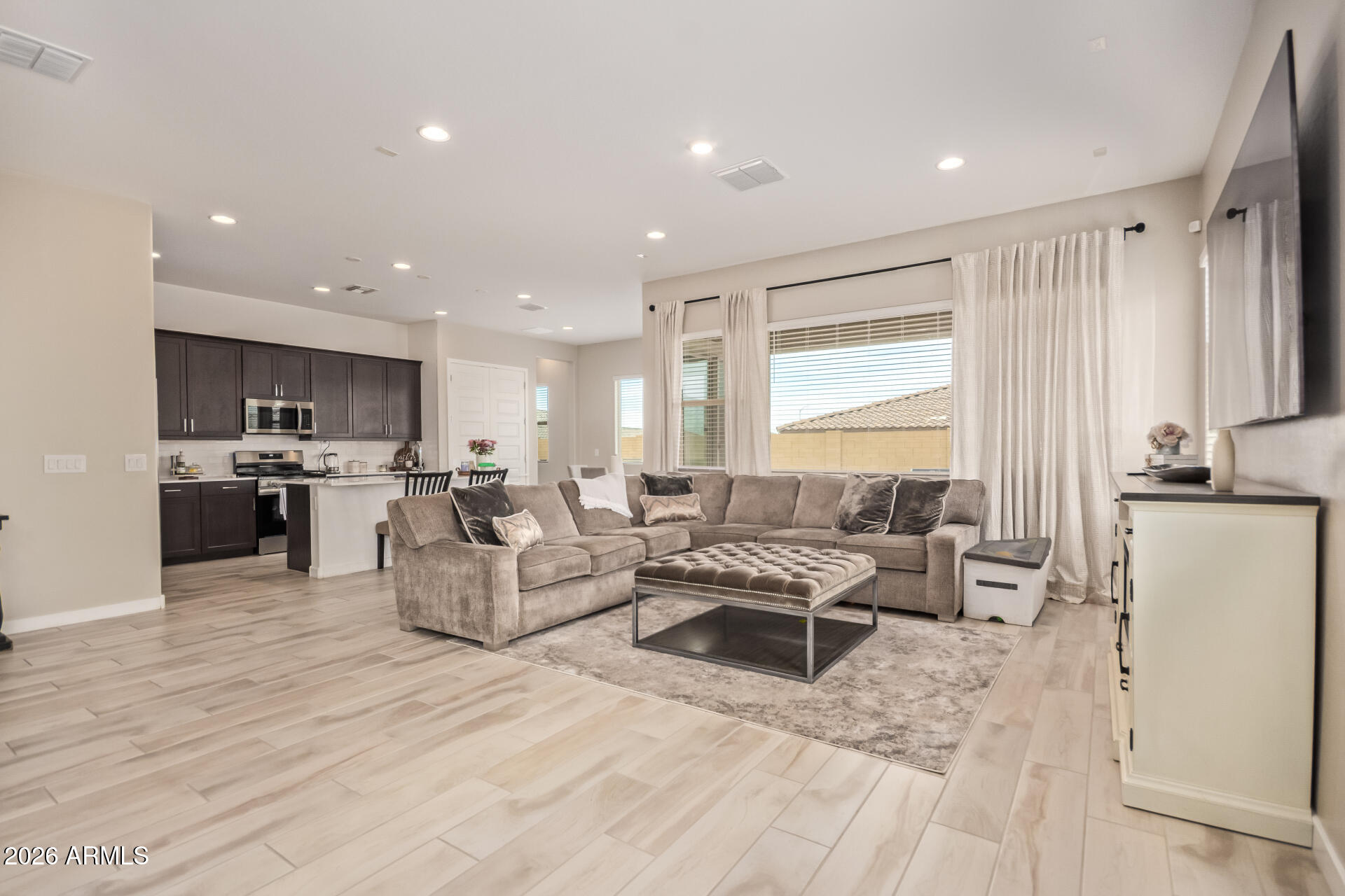 3918 West McNeil Street Laveen, AZ 85339 - Photo 13 of 42 a living room with furniture and a large window