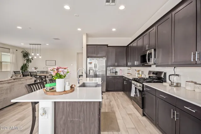a kitchen with granite countertop a sink and stove