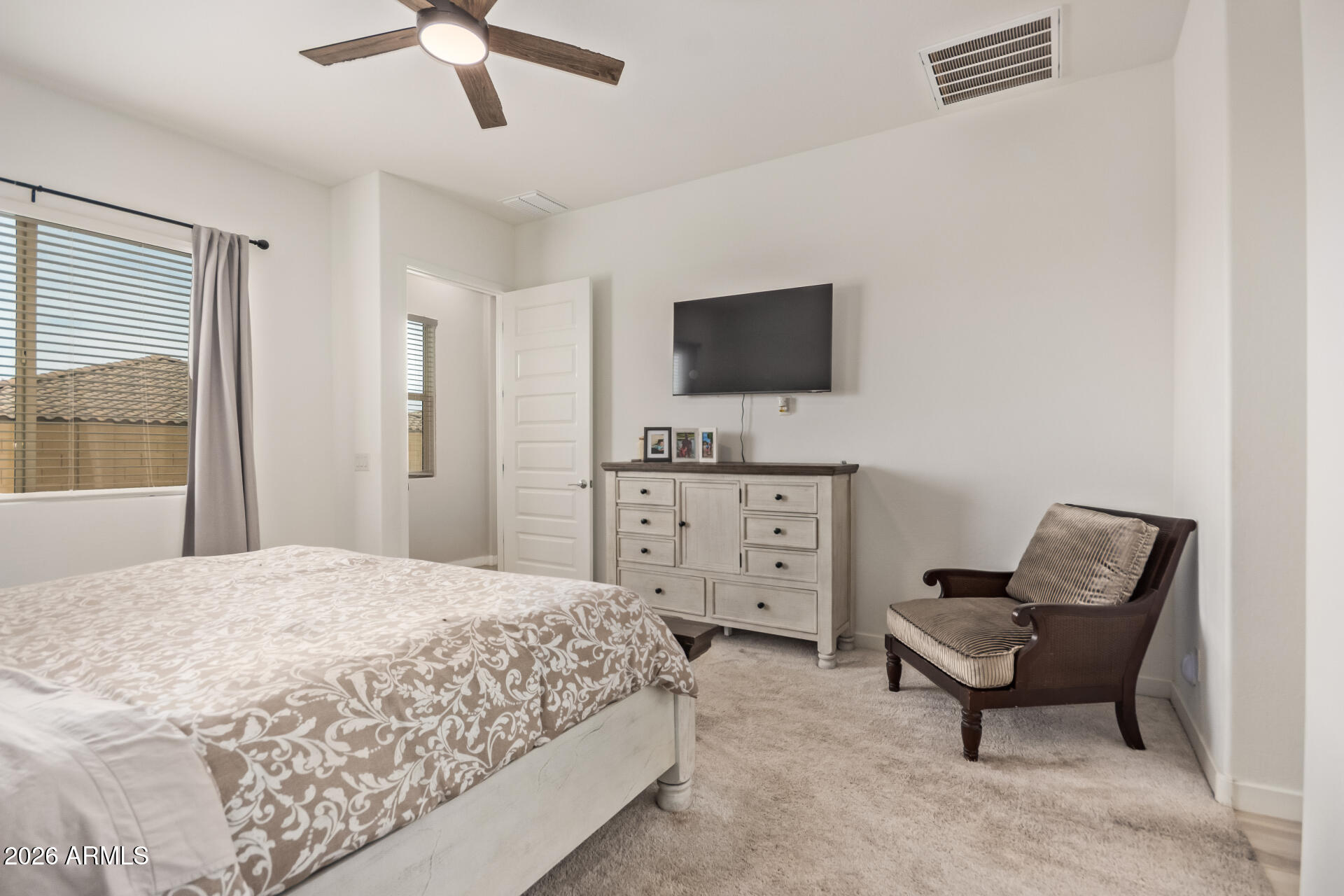 3918 West McNeil Street Laveen, AZ 85339 - Photo 21 of 42 a bedroom with a bed and a television