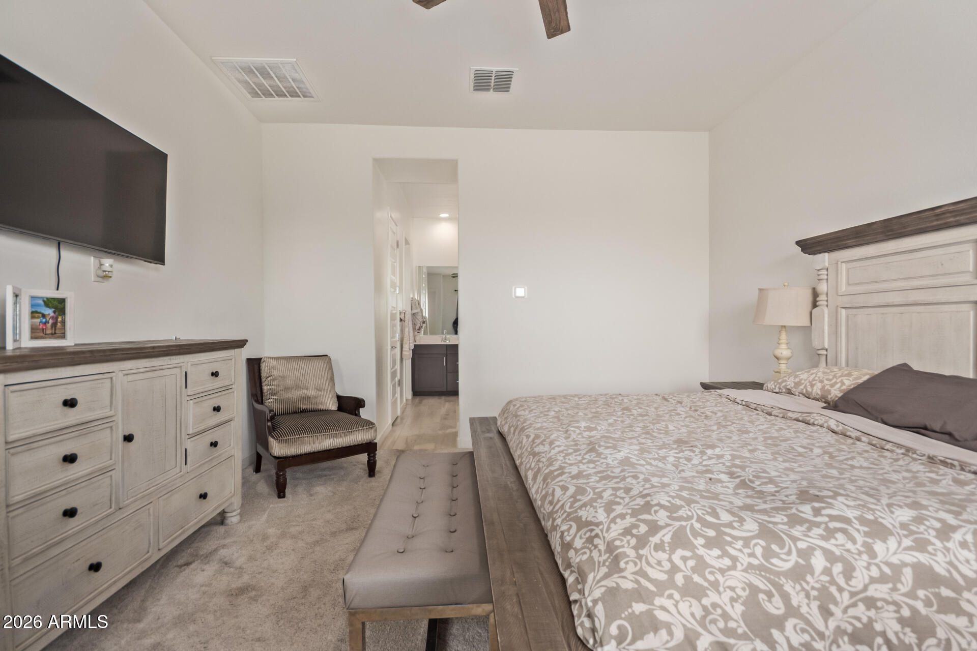 3918 West McNeil Street Laveen, AZ 85339 - Photo 22 of 42 a living room with furniture and a flat screen tv